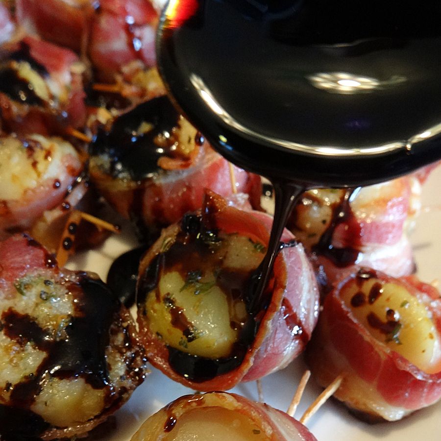 drizzle Propeller Root Beer Reduction over bacon wrapped scallops