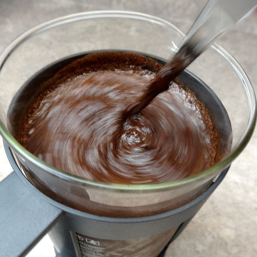 stir coffee grinds and water in french press