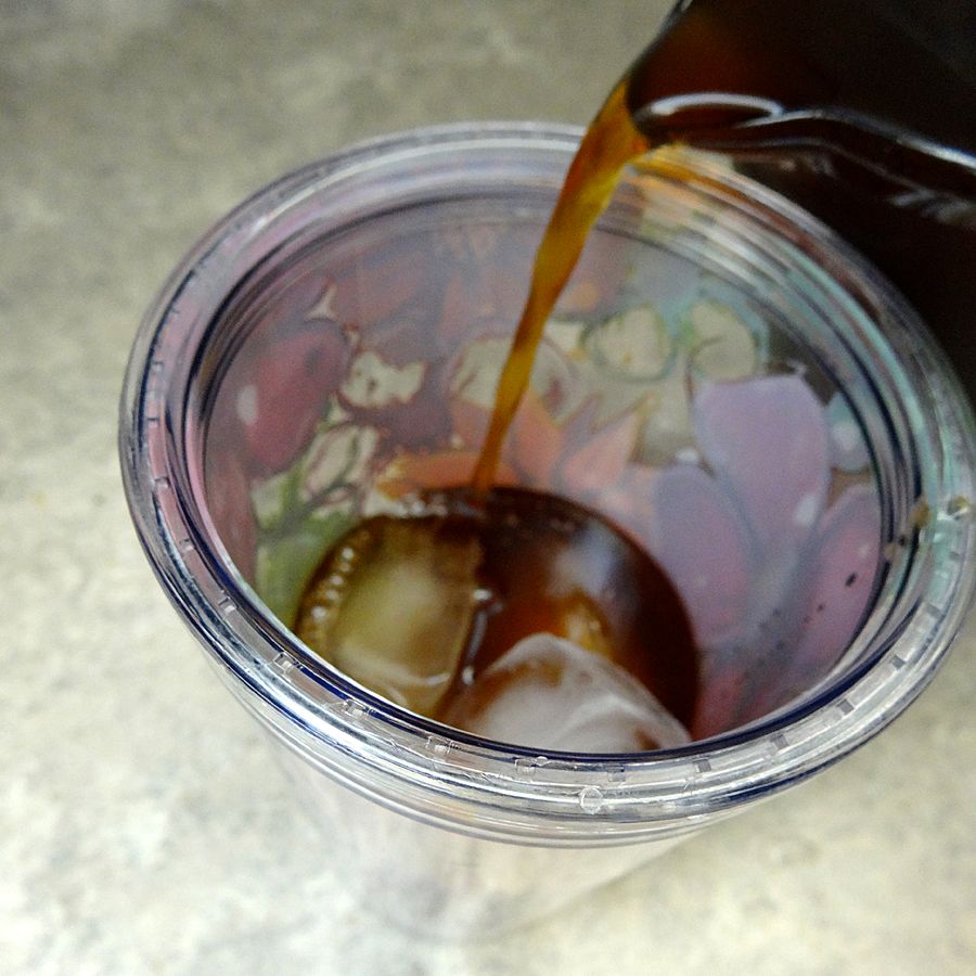 pour iced coffee over ice