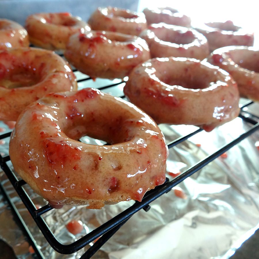 glazed donuts dripping on rack