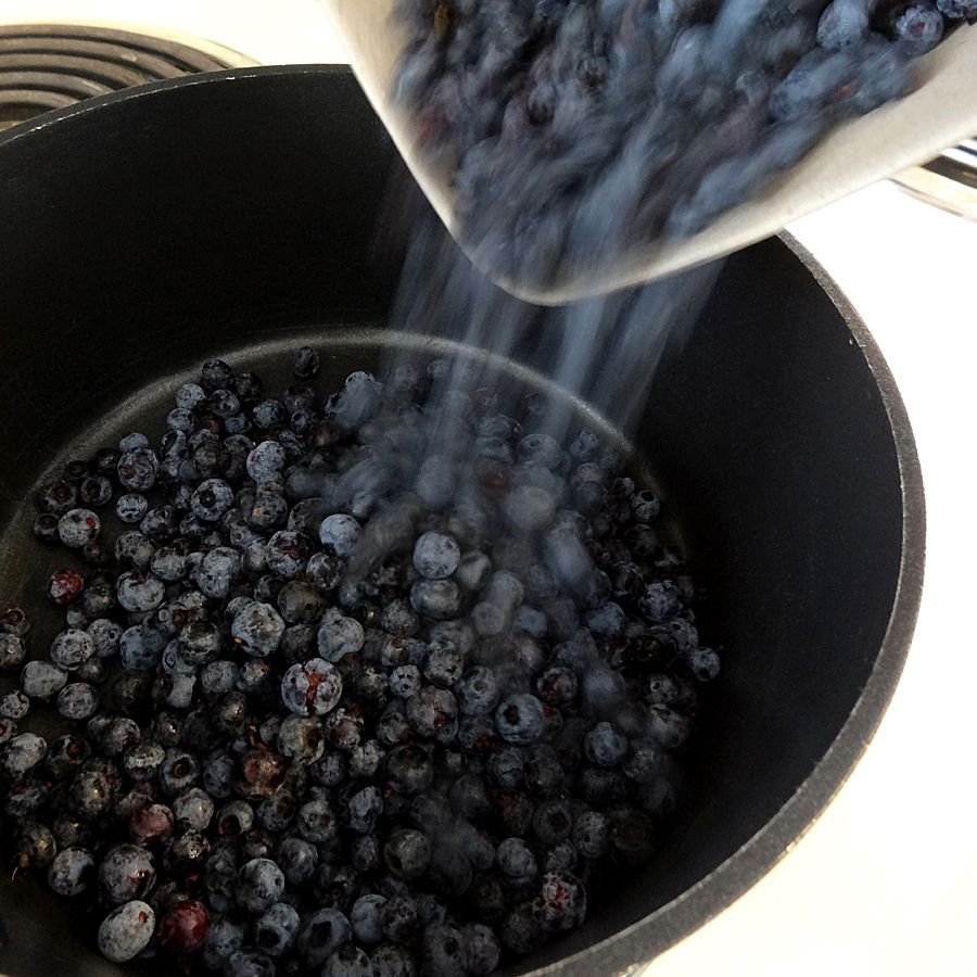 Pouring Glenhill Berry Farms Blueberries into pot