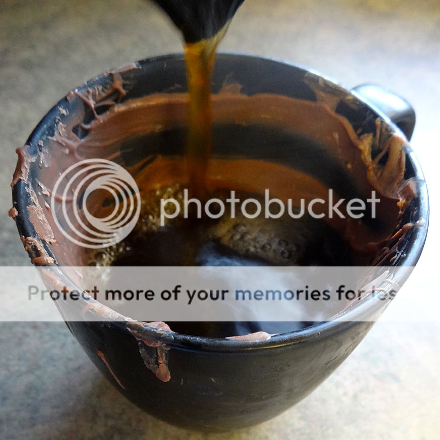 pour coffee into chocolate mug